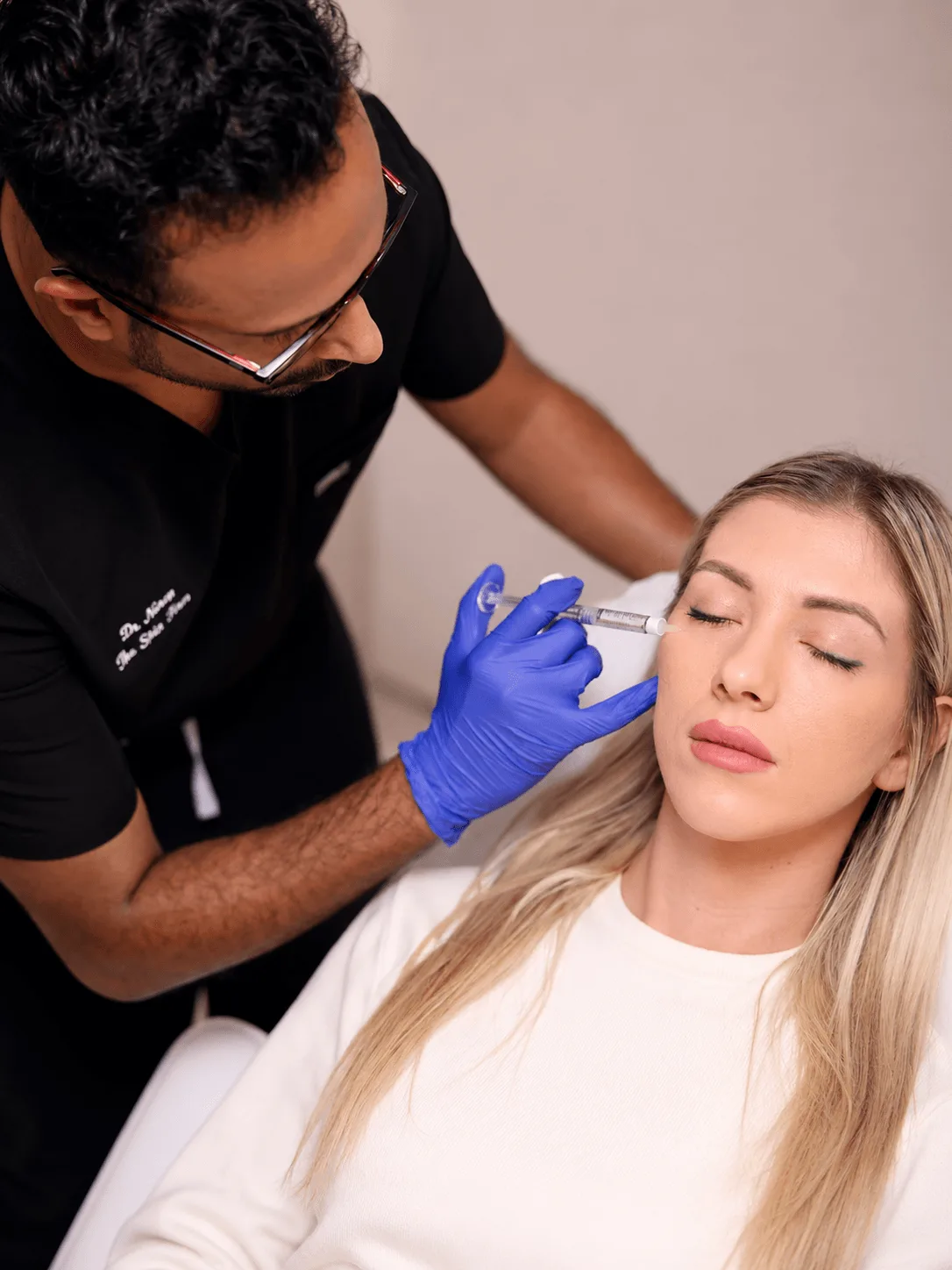 Dr. Naren performing an aesthetic treatment at The Skin Firm